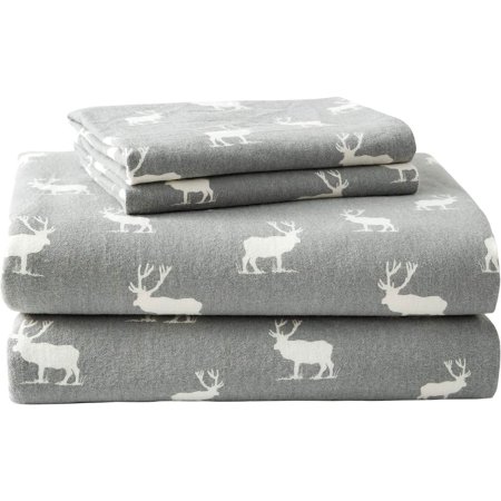  The Eddie Bauer Cotton Flannel Sheet Set with a grey and white elk pattern folded and stacked on a white background.