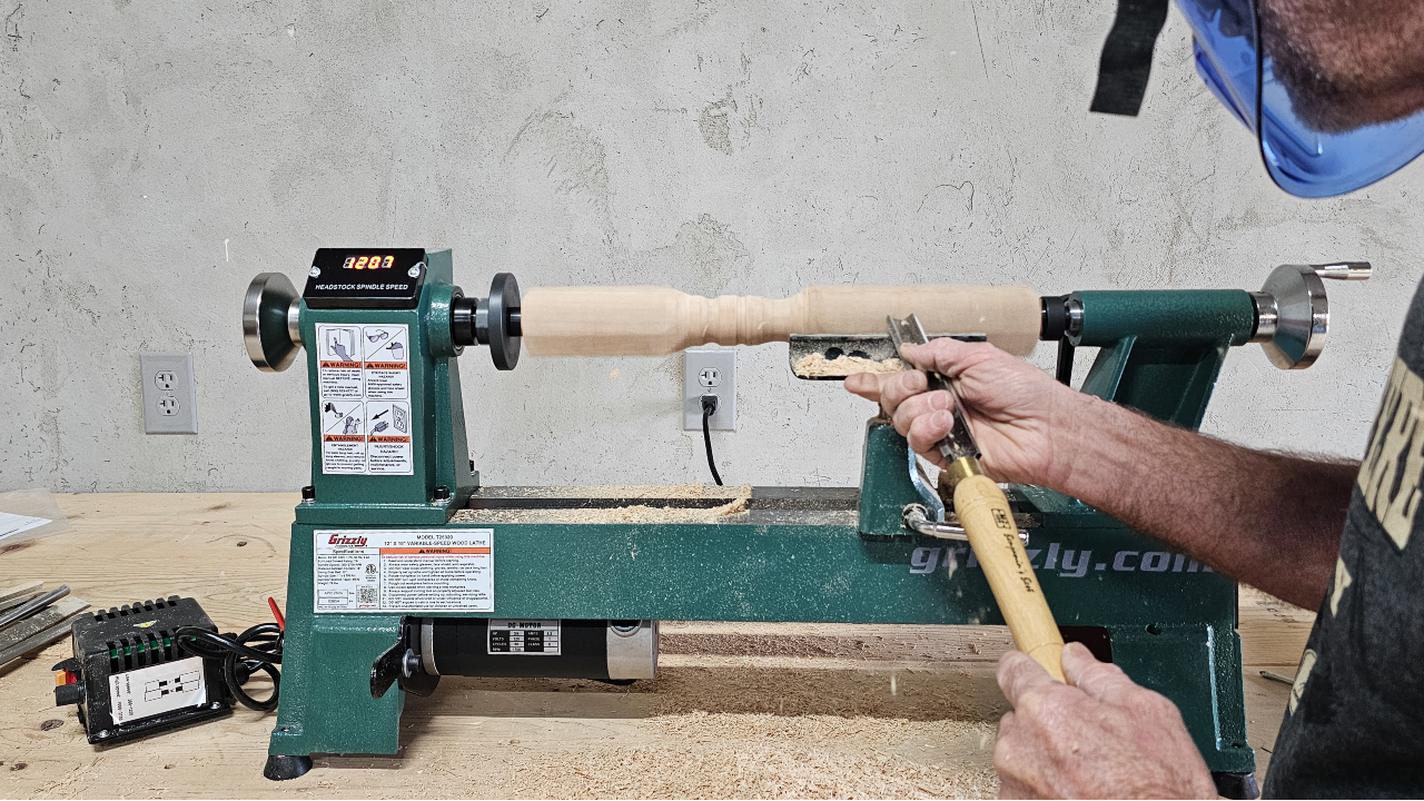 Turning stock on the Grizzly lathe to make a wood spindle