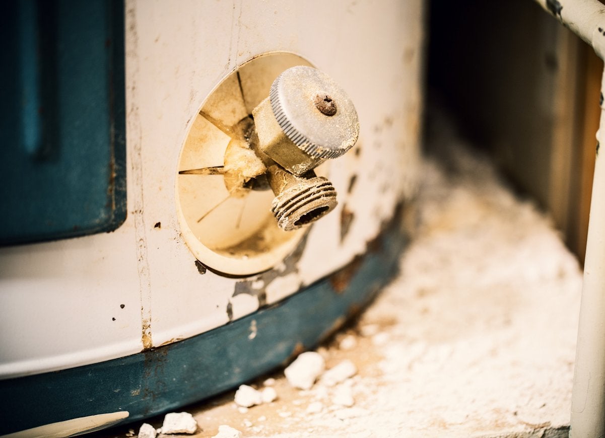 A dried up spout of a water heater.