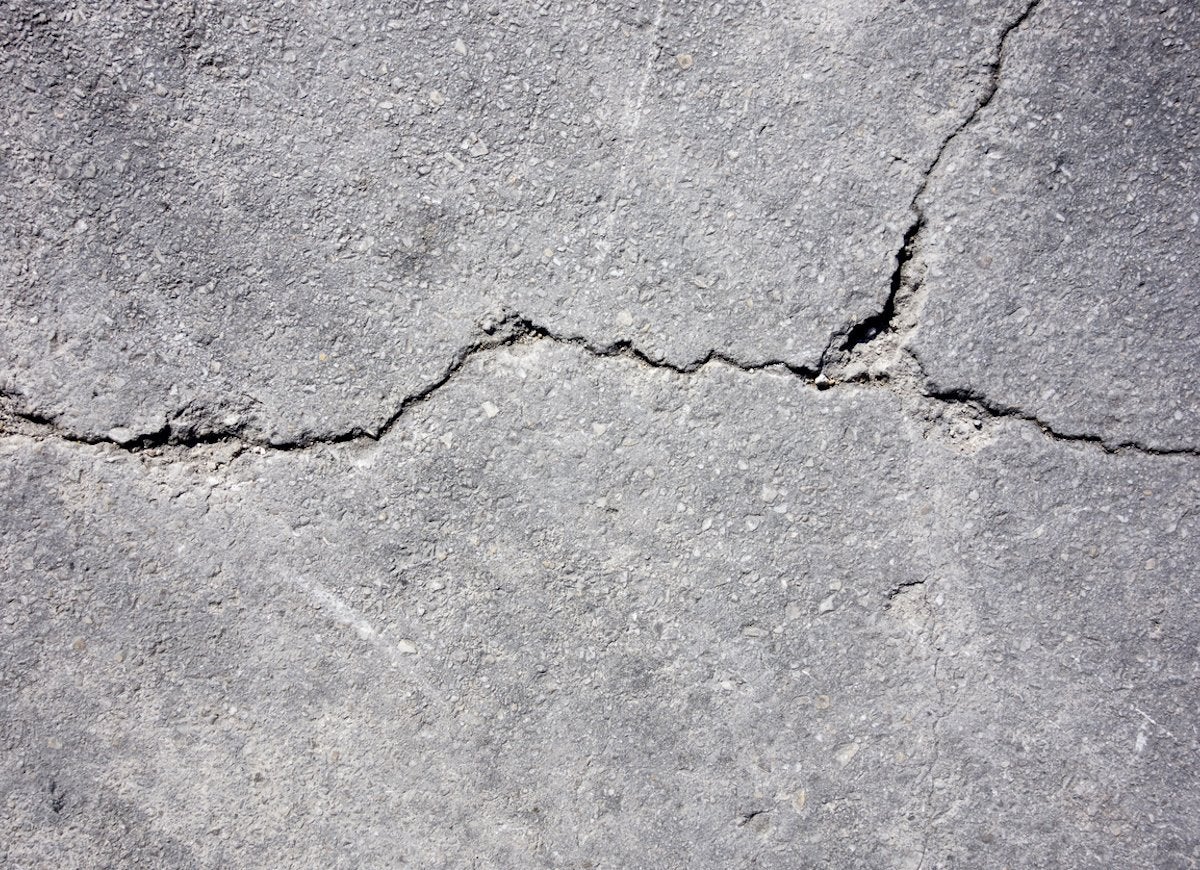 Cracked and damaged concrete.