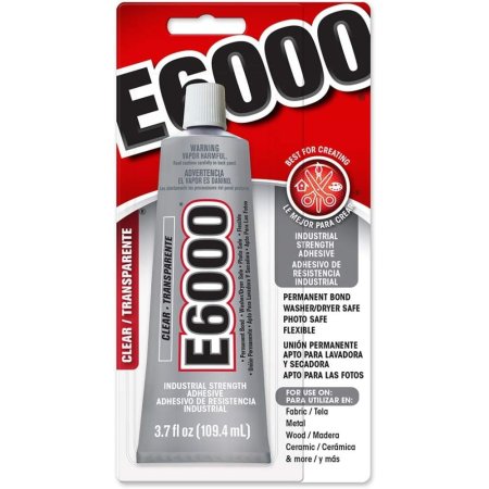  A silver tube of the Eclectic Products E6000 Craft Adhesive in its packaging on a white background.