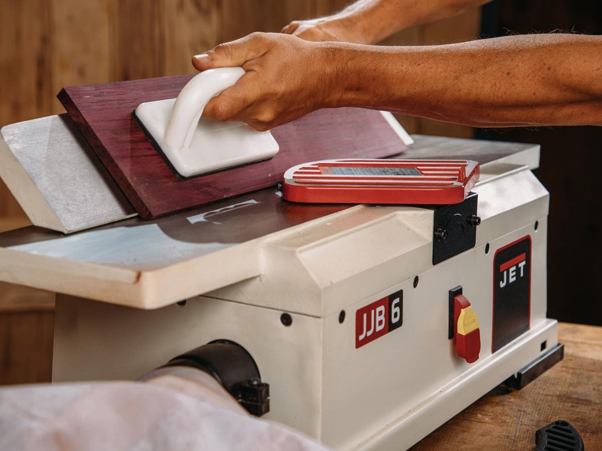 man working on a benchtop jointers