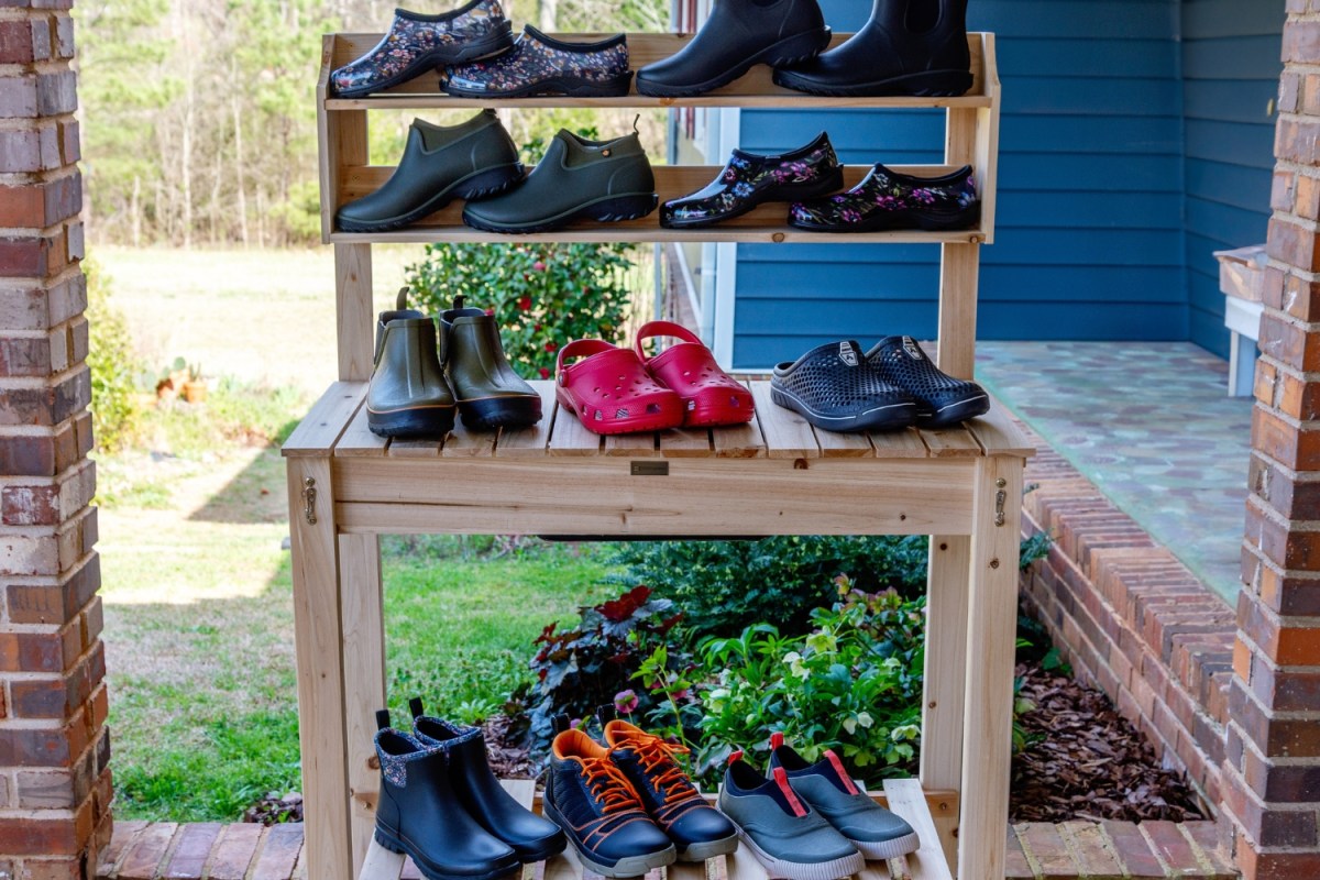 A group of the best gardening shoes together on a potting bench before testing.