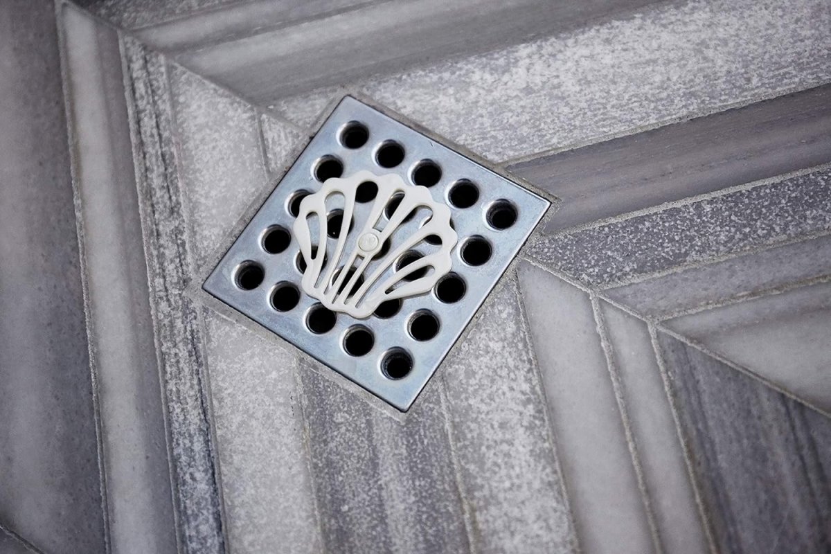 A drain hair catcher on a shower drain