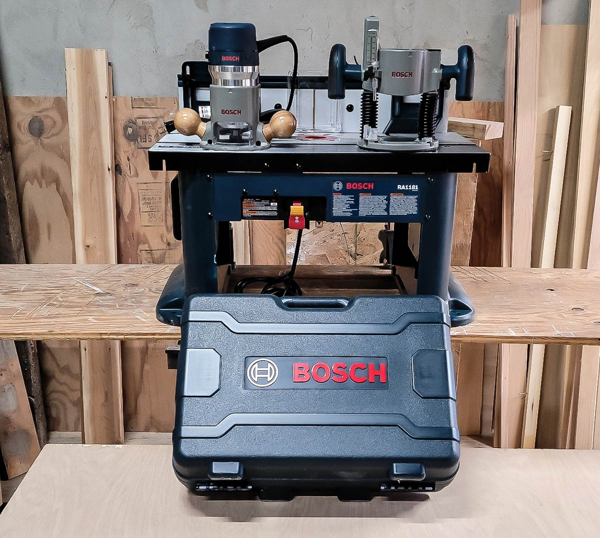 Bosch 1617EVSPK Plunge- and Fixed-Base Router Kit sitting in a wood workshop