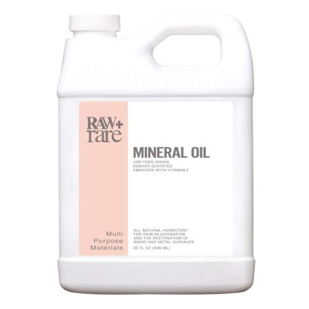  A jug of Raw Plus Rare Food Grade Mineral Oil on a white background.