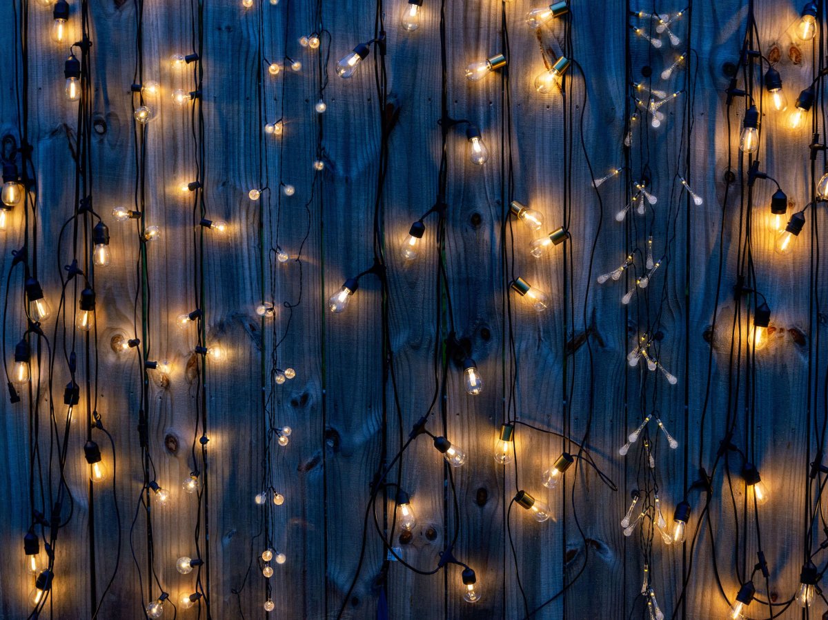 A group shot of the best solar string lights options lit up at night