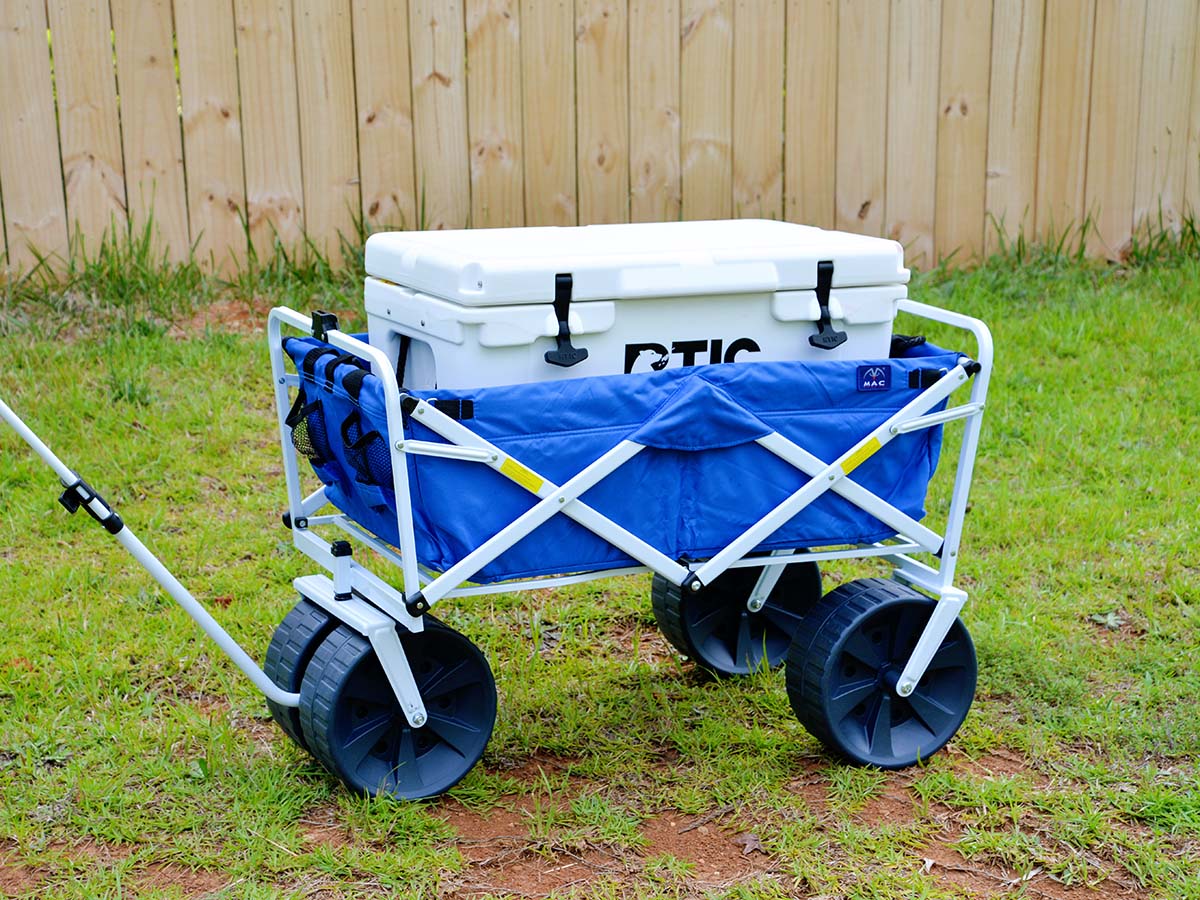 The best folding wagon option being used in yard to transport a cooler