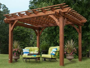 The best pergola kit option assembled in a yard with chairs, a table, and plants beneath it