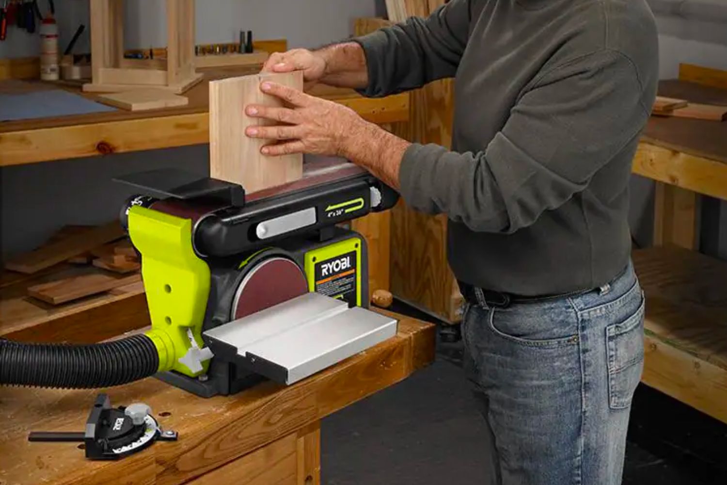 A person using the best belt sander option to sand a small block of wood