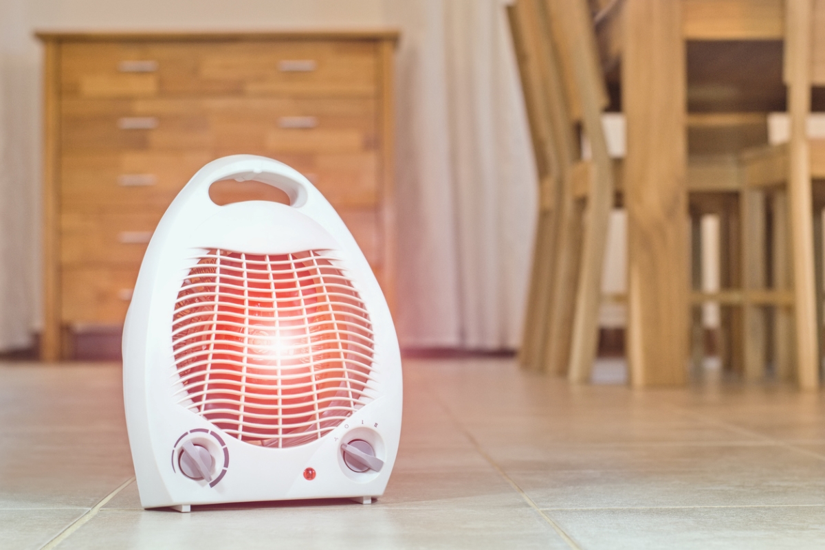 Space heater on kitchen floor.