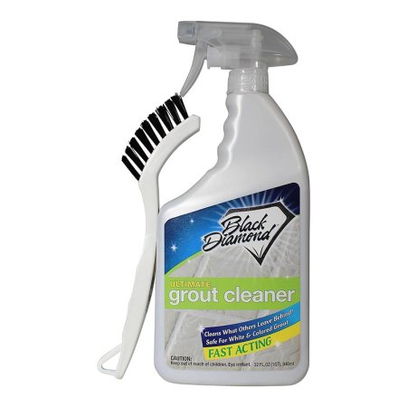  A spray bottle of the Black Diamond Stoneworks Ultimate Grout Cleaner with a brush on a white background.