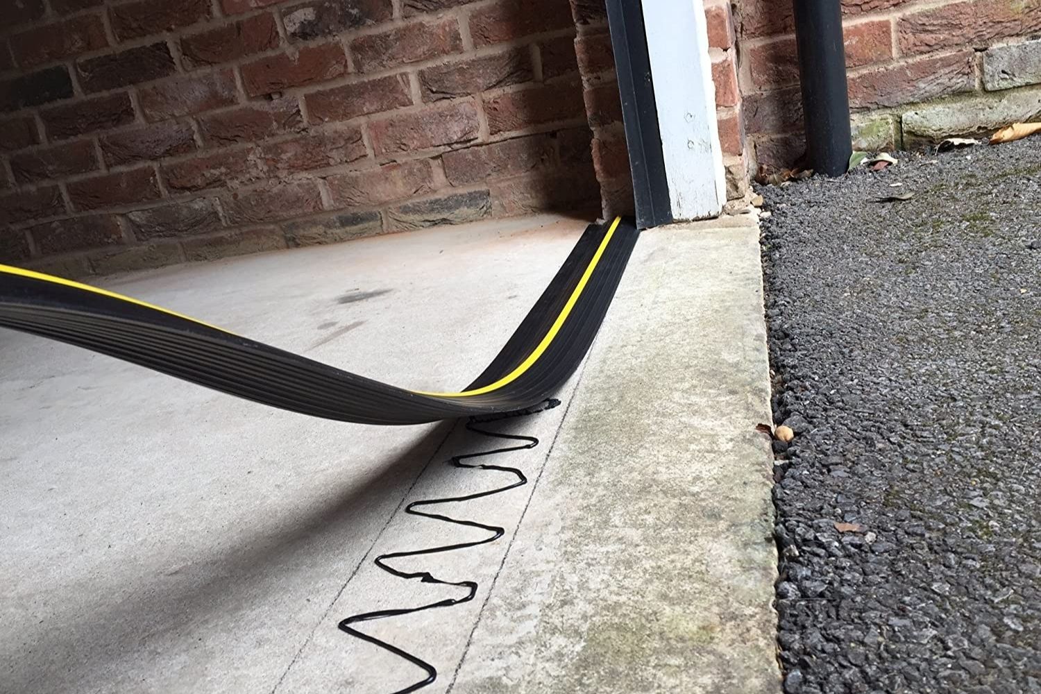 The best garage door threshold option being installed on a garage floor