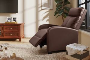 A brown leather recliner in a living room