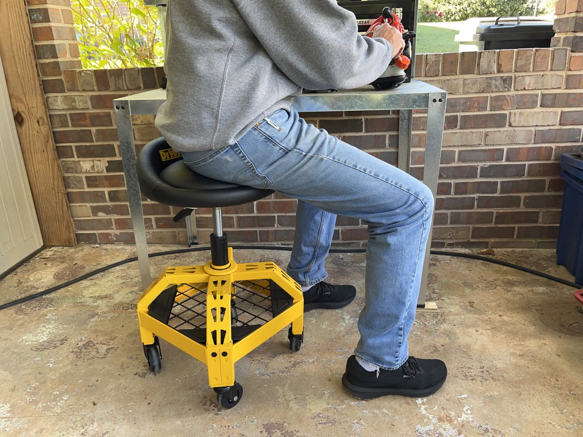 a man sitting on one of the best shop stools 