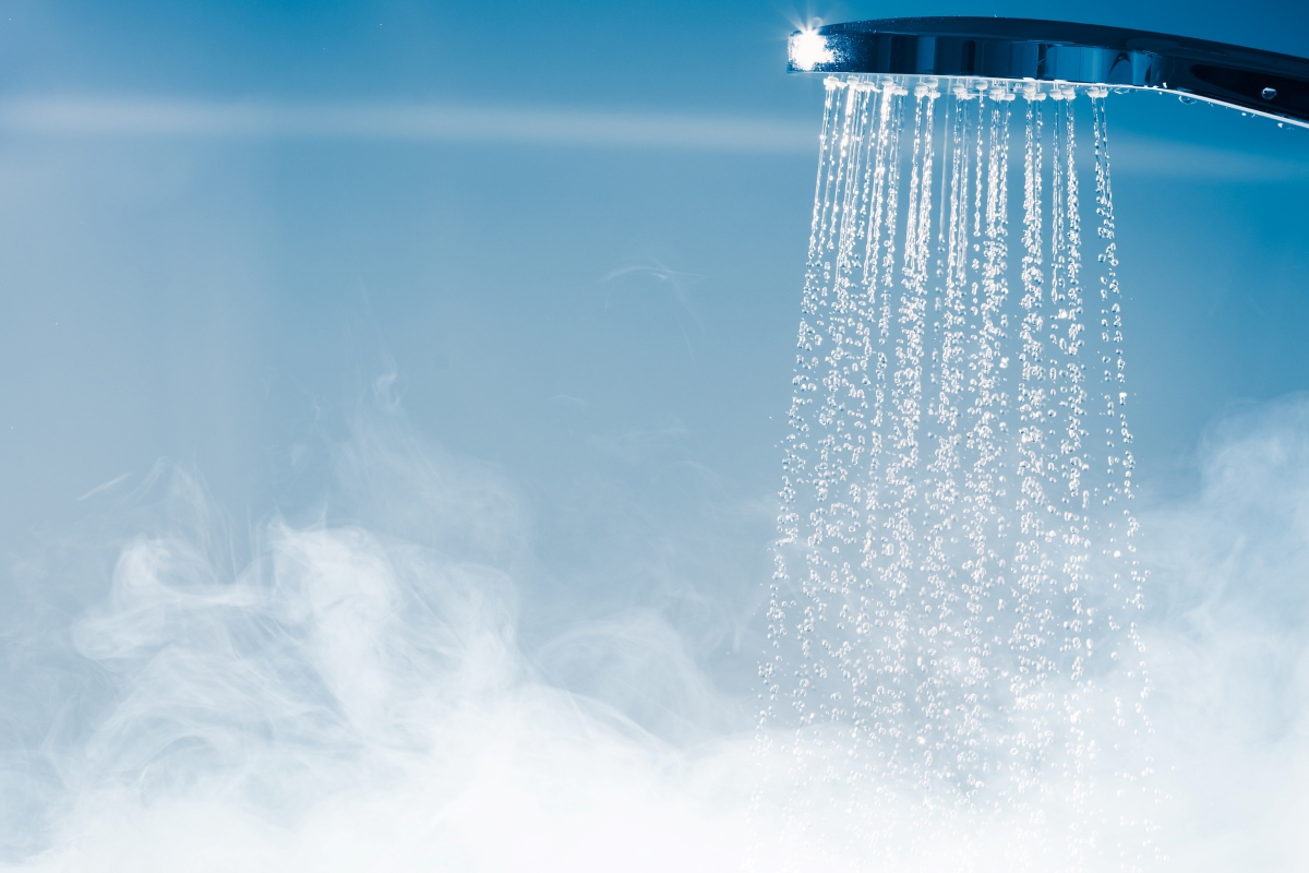 Steamy water is coming out of the shower head.