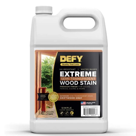  A jug of Defy Extreme Semi-Transparent Wood Stain on a white background.