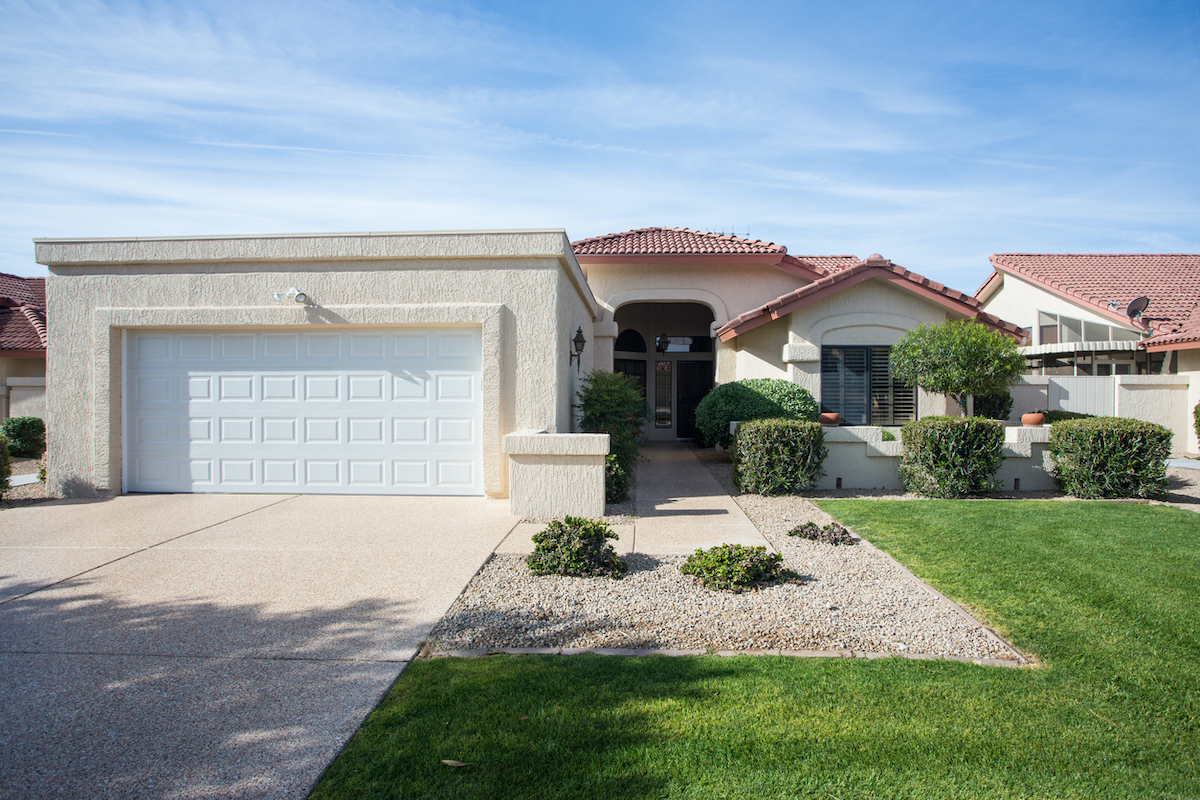 house in desert with front lawn of ornamental grass