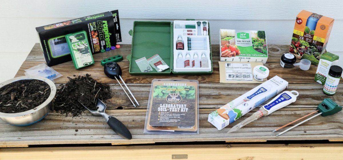 Multiple soil test kits lined up on a table