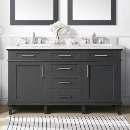  The Home Decorators Collection Sonoma Bath Vanity on a tan floor with a black and white rug in front and a vase of flowers on top.