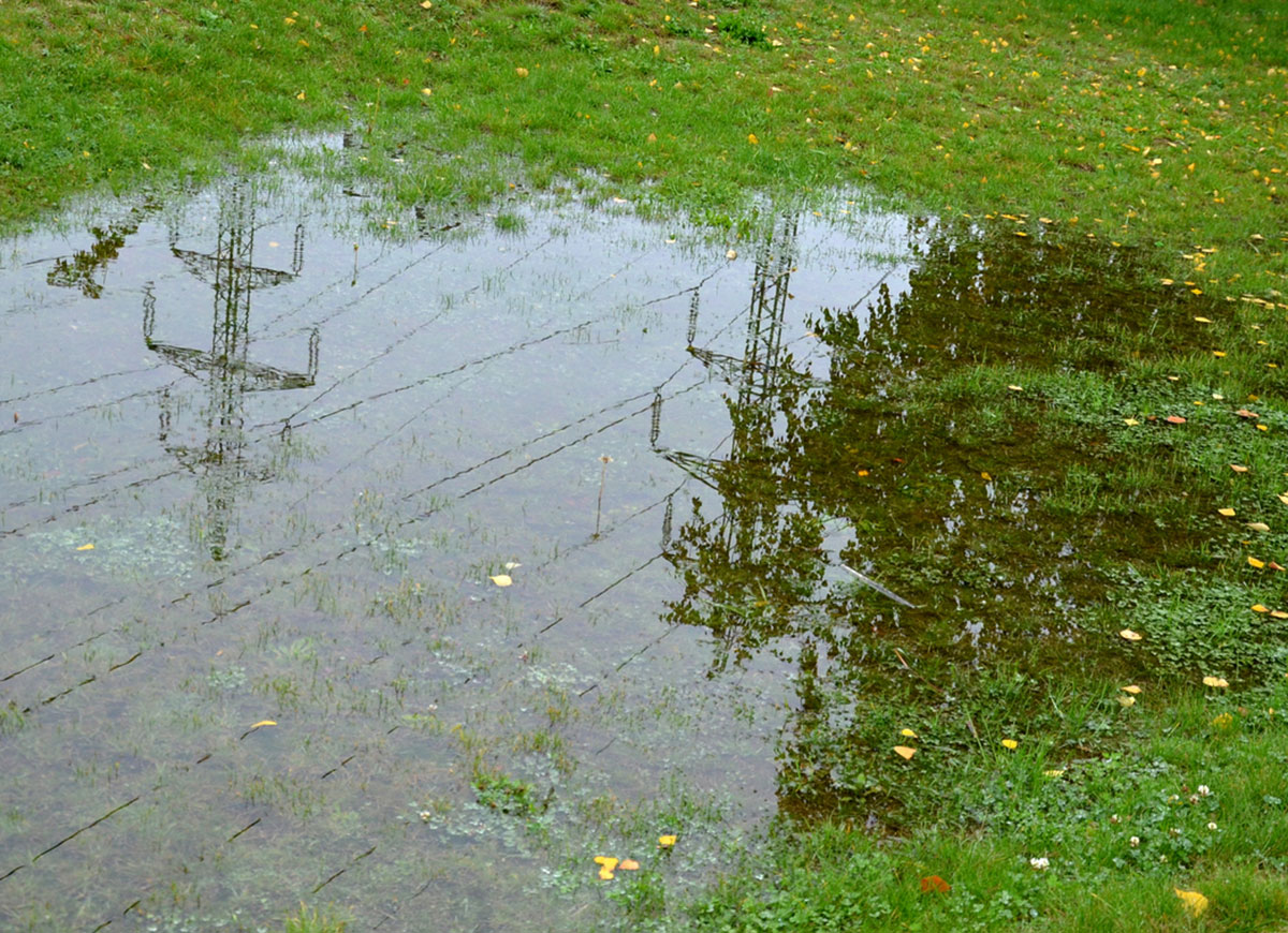 french drain cleaning flooded yard