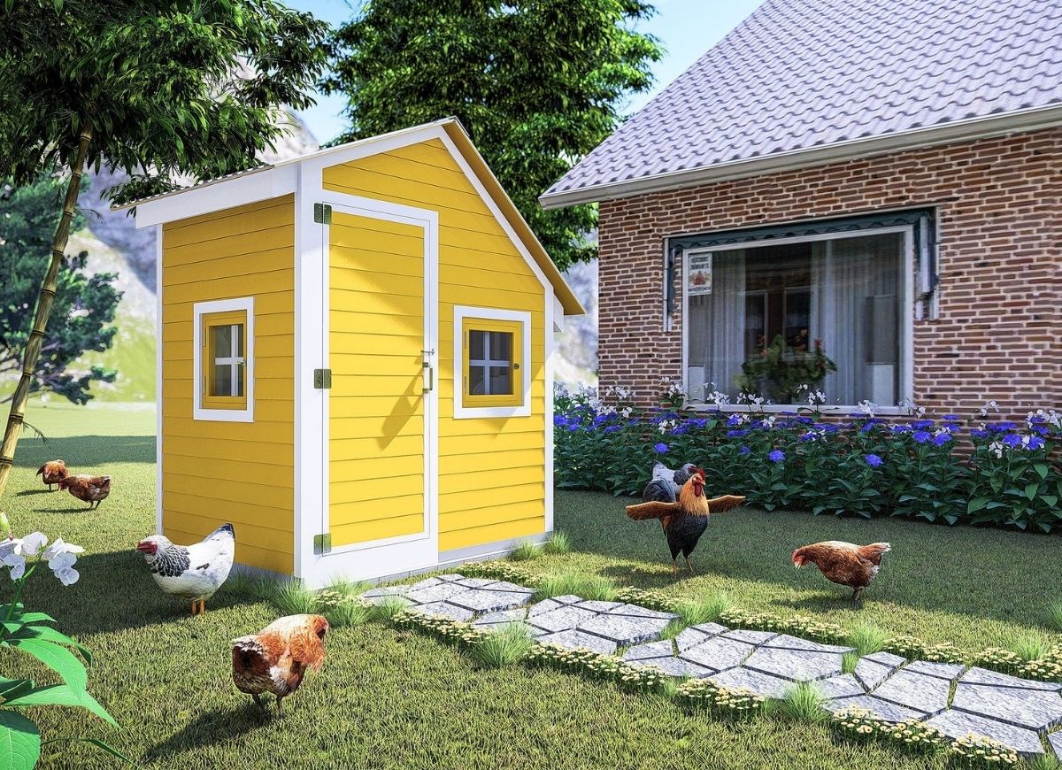 Cheerful, small yellow chicken coop with white trim.