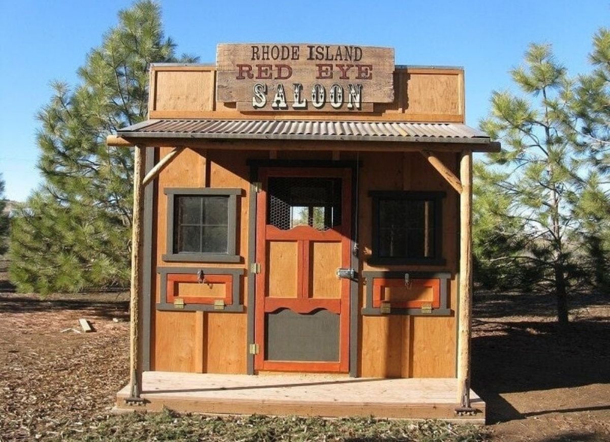 Wooden chicken coop styled as a western saloon.