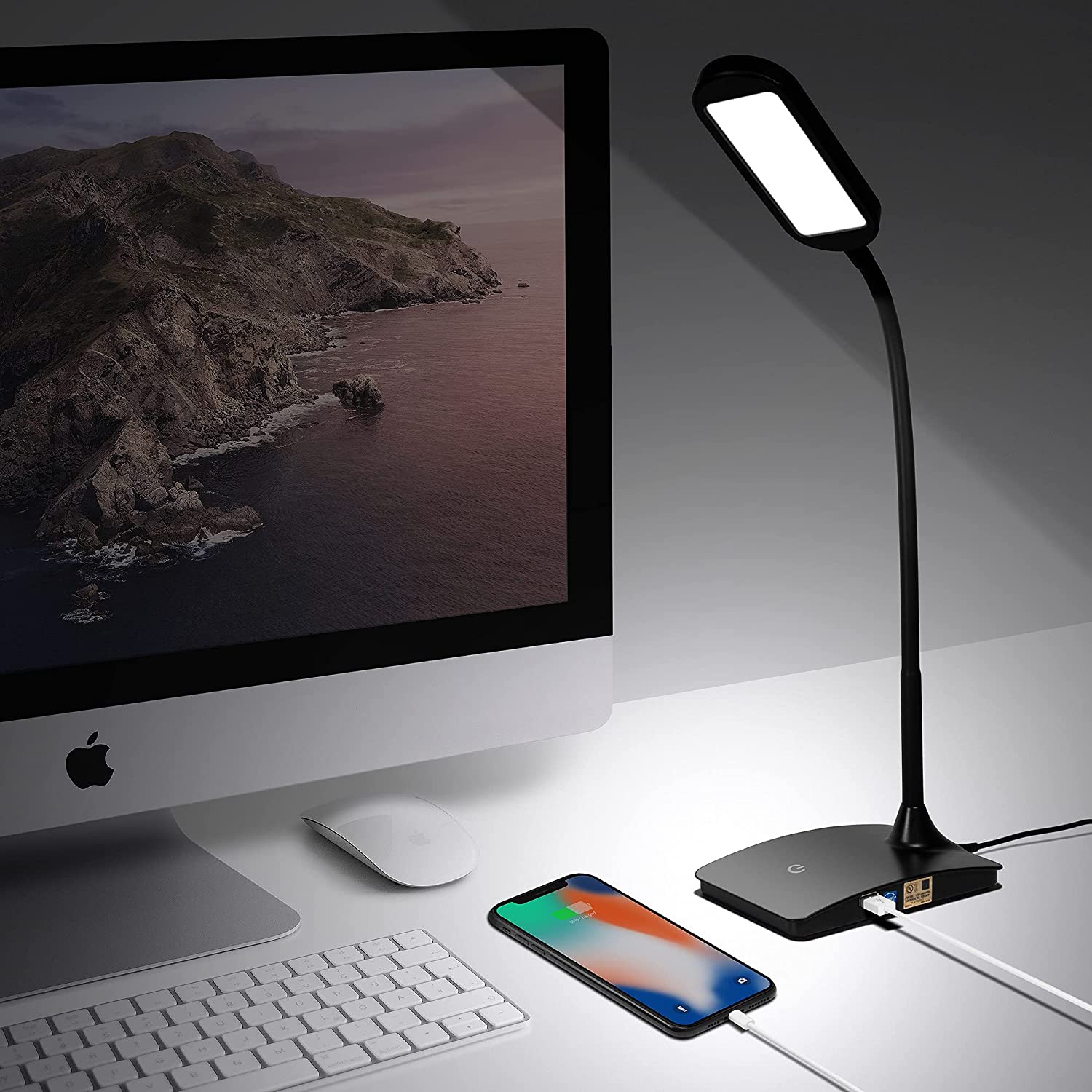 TW Lighting Ivy desk lamp on a white desk next to a smartphone and computer monitor.