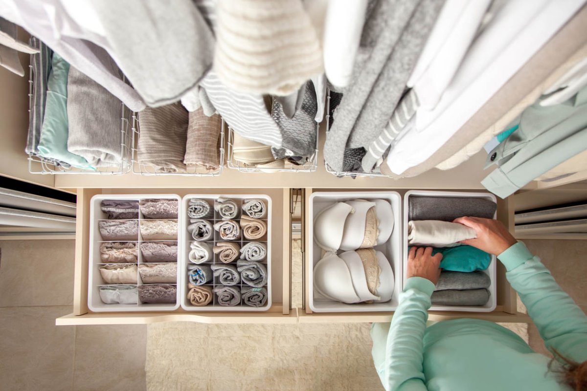 An aerial view of a neatly organizes drawer of clothing.