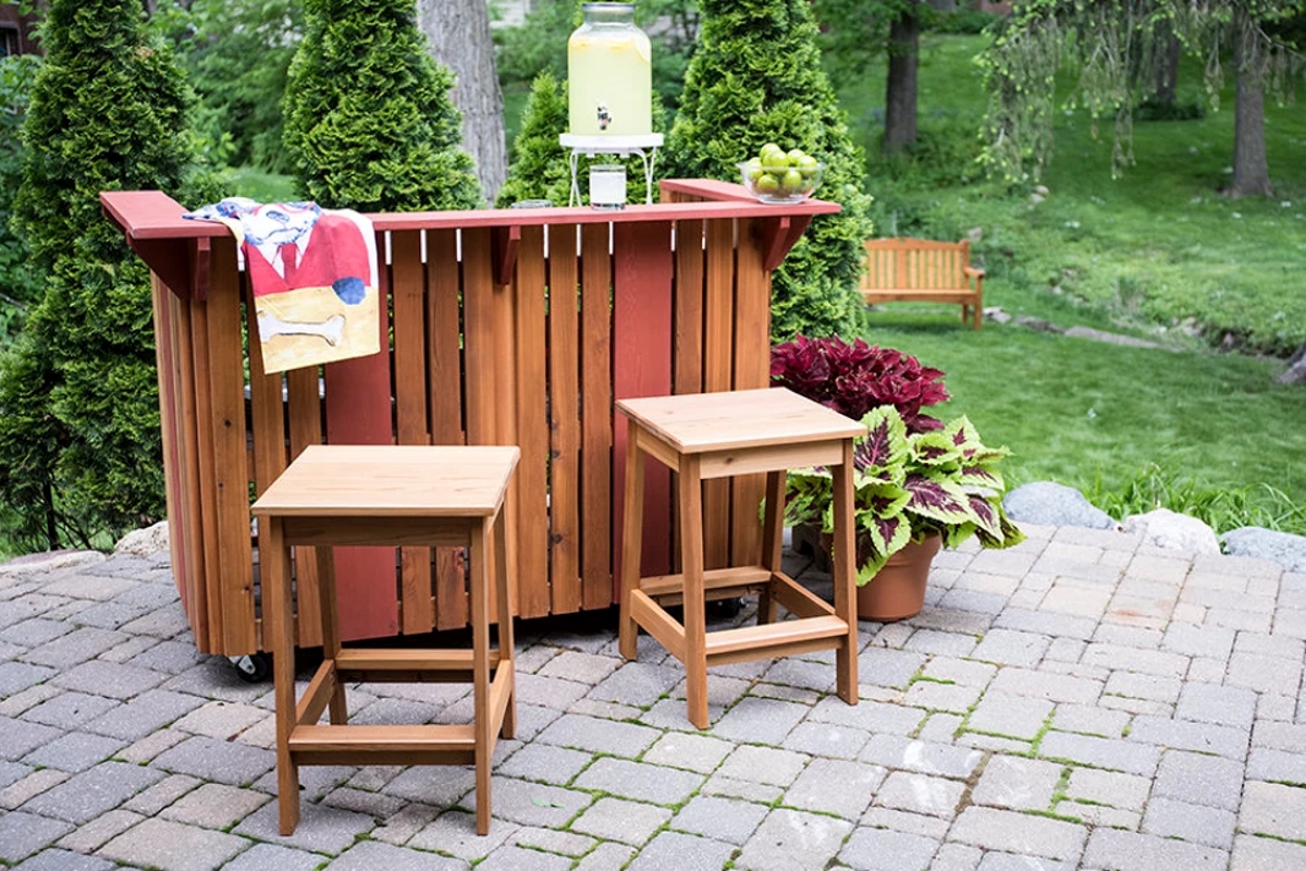 Backyard wooden bar with matching chairs.