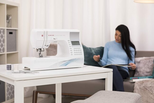 A sewing machine on a table in a living space