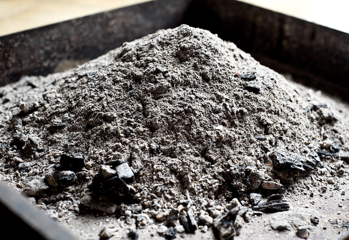 Chimney ashes in a metal pan or bucket.