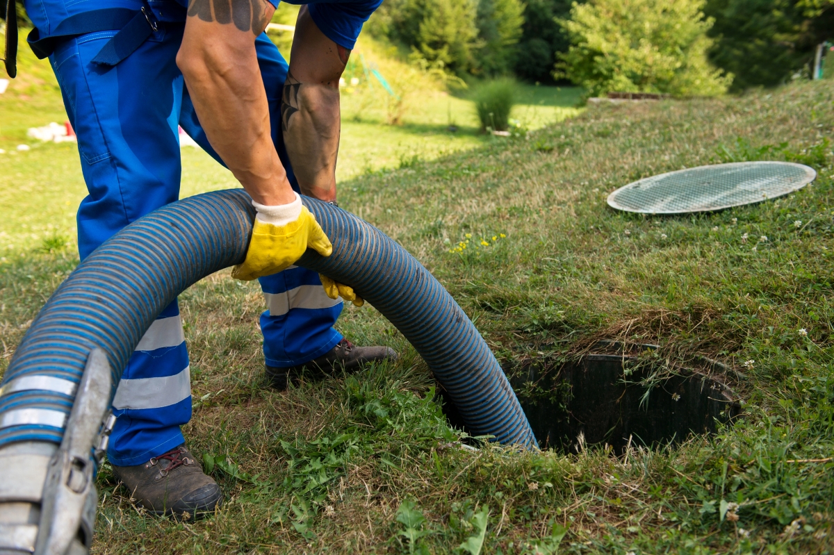 A professional is cleaning the septic tank. 