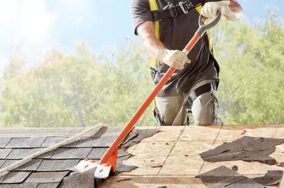 demolition tools - person using shingle remover