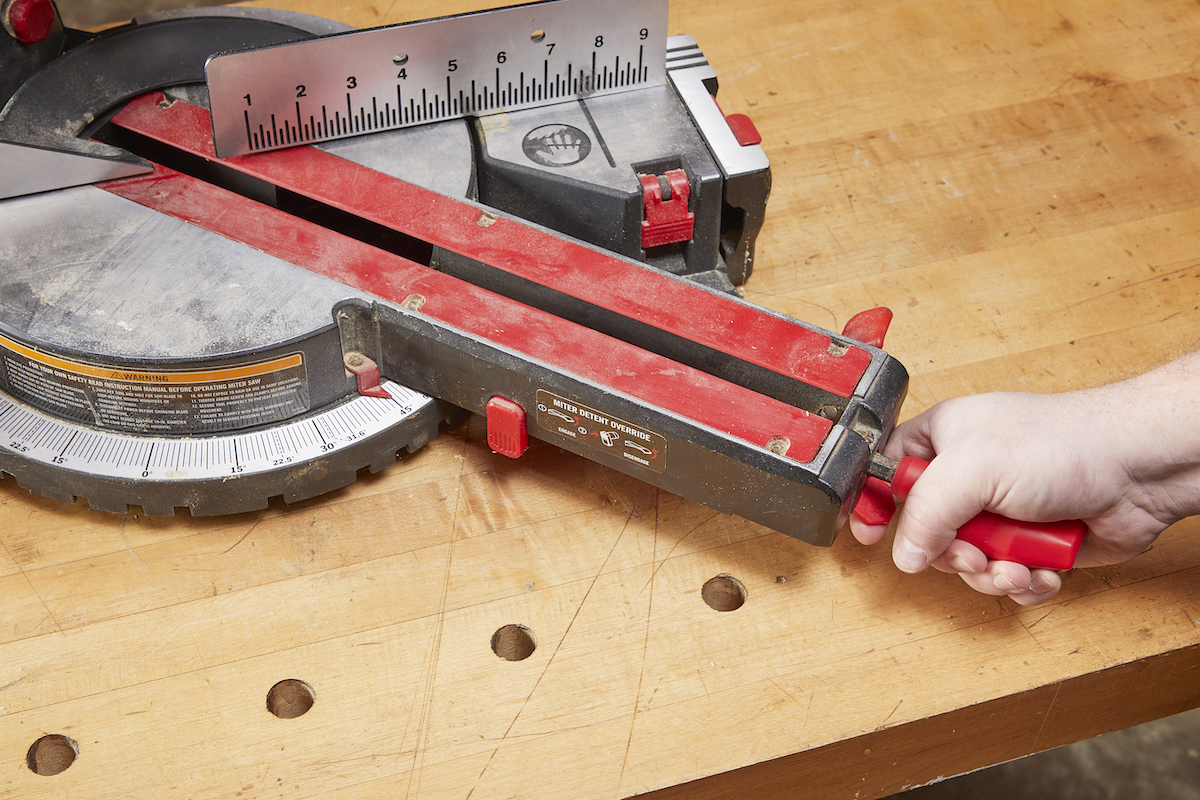 Setting angle on a miter saw before making a miter cut.