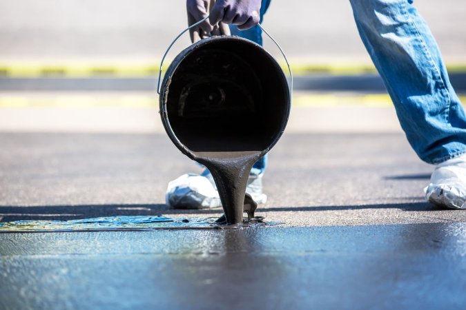 A close up of driveway sealing.