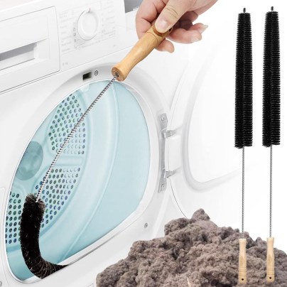 The Holikme 2-Pack Flexible Lint Brush Dryer Vent Cleaner cleaning a dryer vent with a pile of lint next to it.