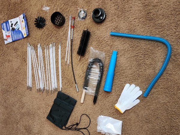 All the pieces of the Holikme 30-Foot 11-Piece Dryer Vent Cleaner Kit laid out before testing.