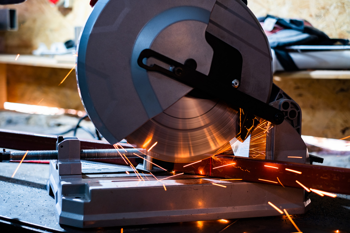 chop saw vs miter saw - chop saw cutting metal