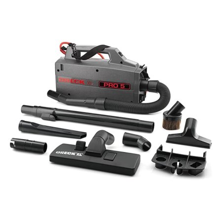  The Oreck BB900-DGR Pro 5 Super Compact Canister Vacuum with its included accessories on a white background.