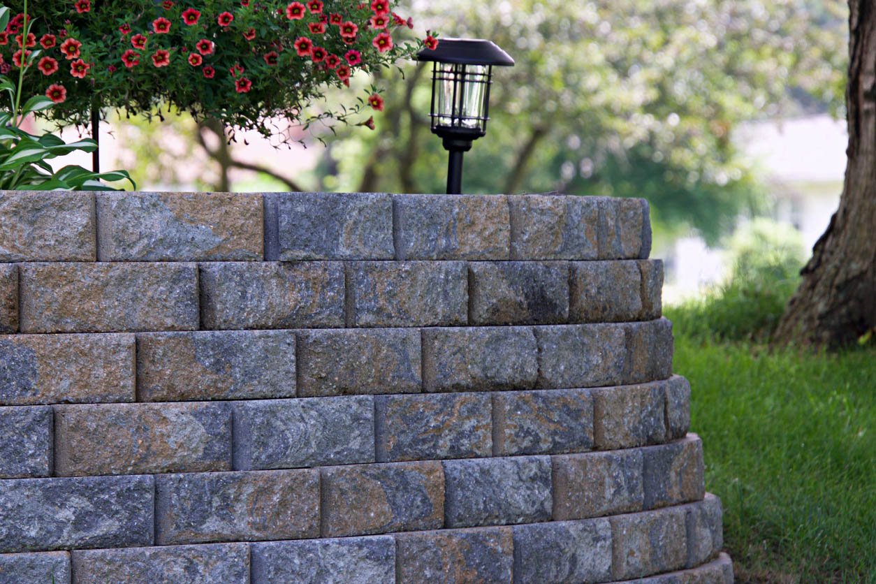 A close up of a retaining wall in a garden.