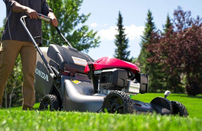 A person using the Best Mulching Lawn Mower to mow their lawn.