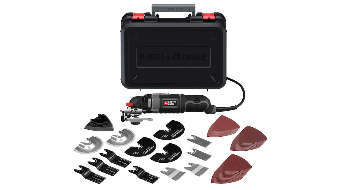 An open black case that contains the various components to a Oscillating Tool, which are displayed in an organized fashion. 