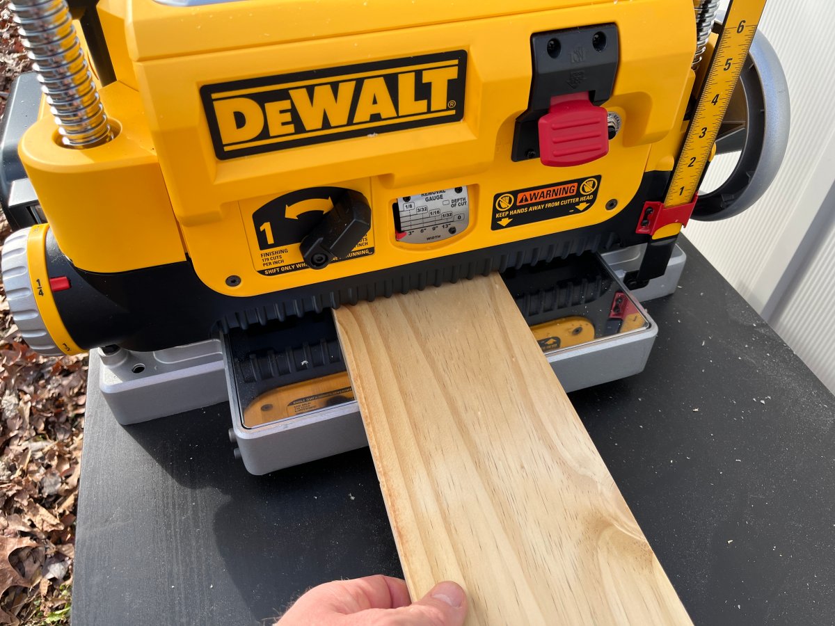 a man working with DeWalt Jointer controls