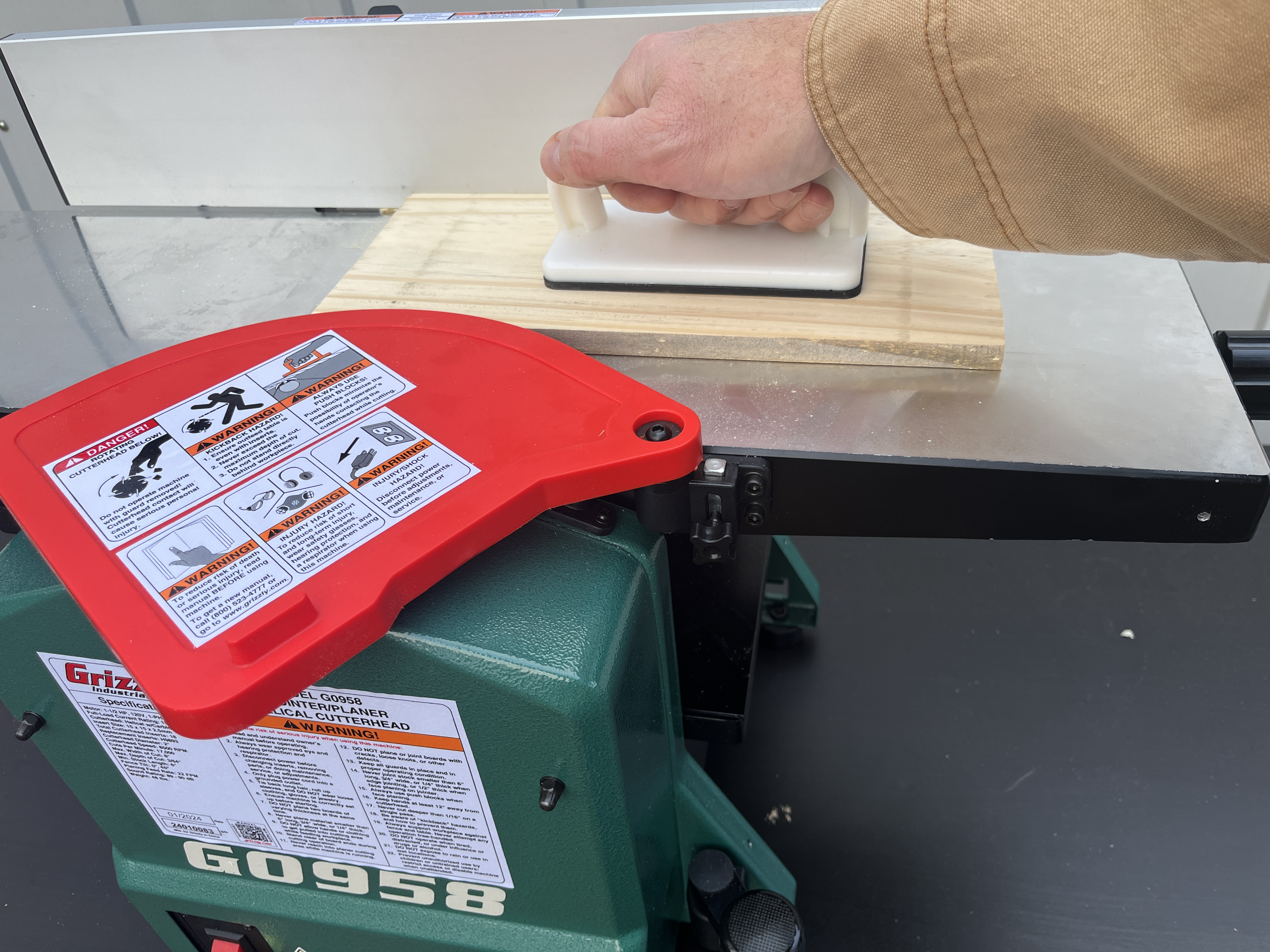 a man working with Grizzly jointer planer jointing mode