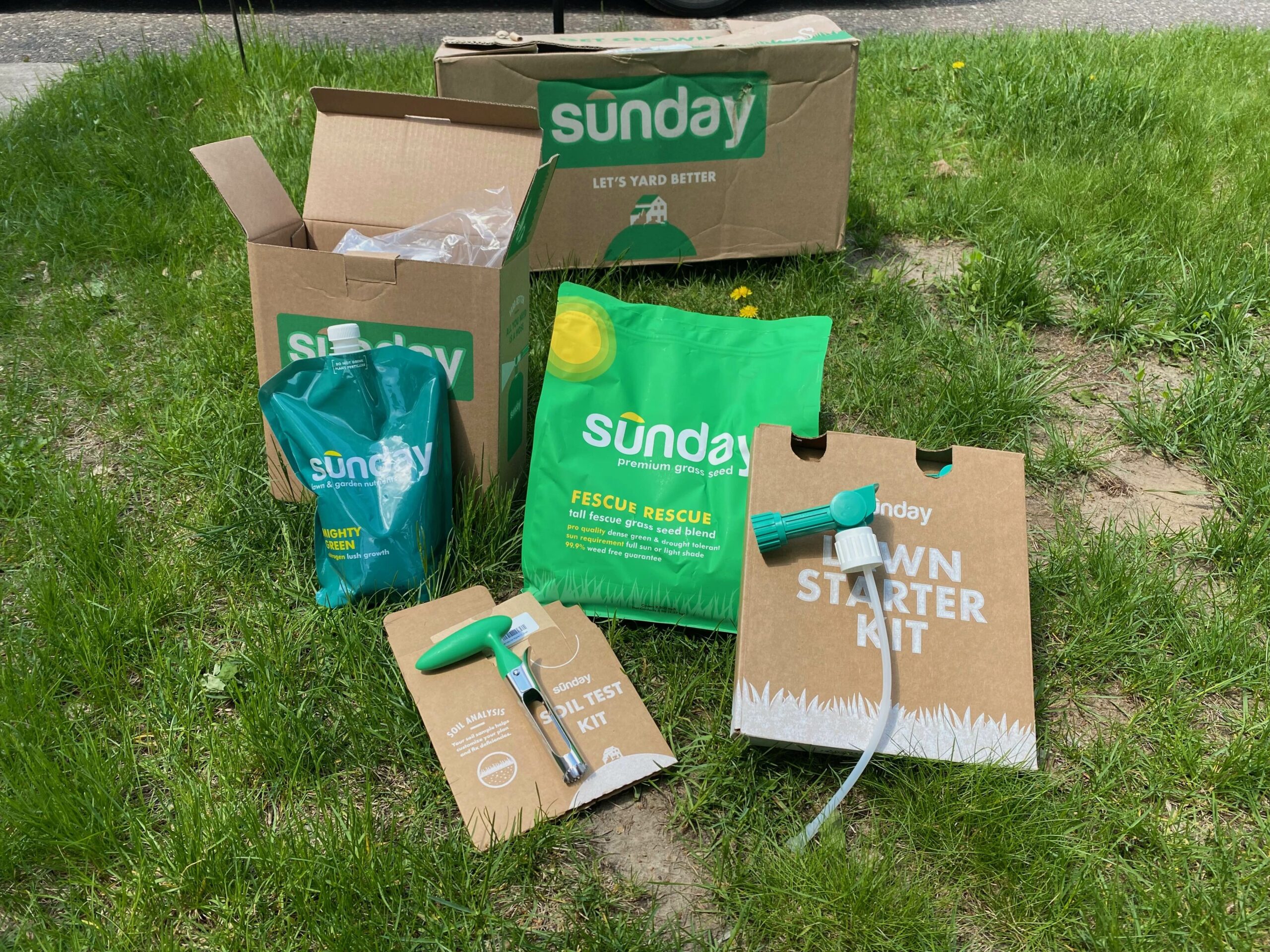 A collection of Sunday product sit on a lawn. 