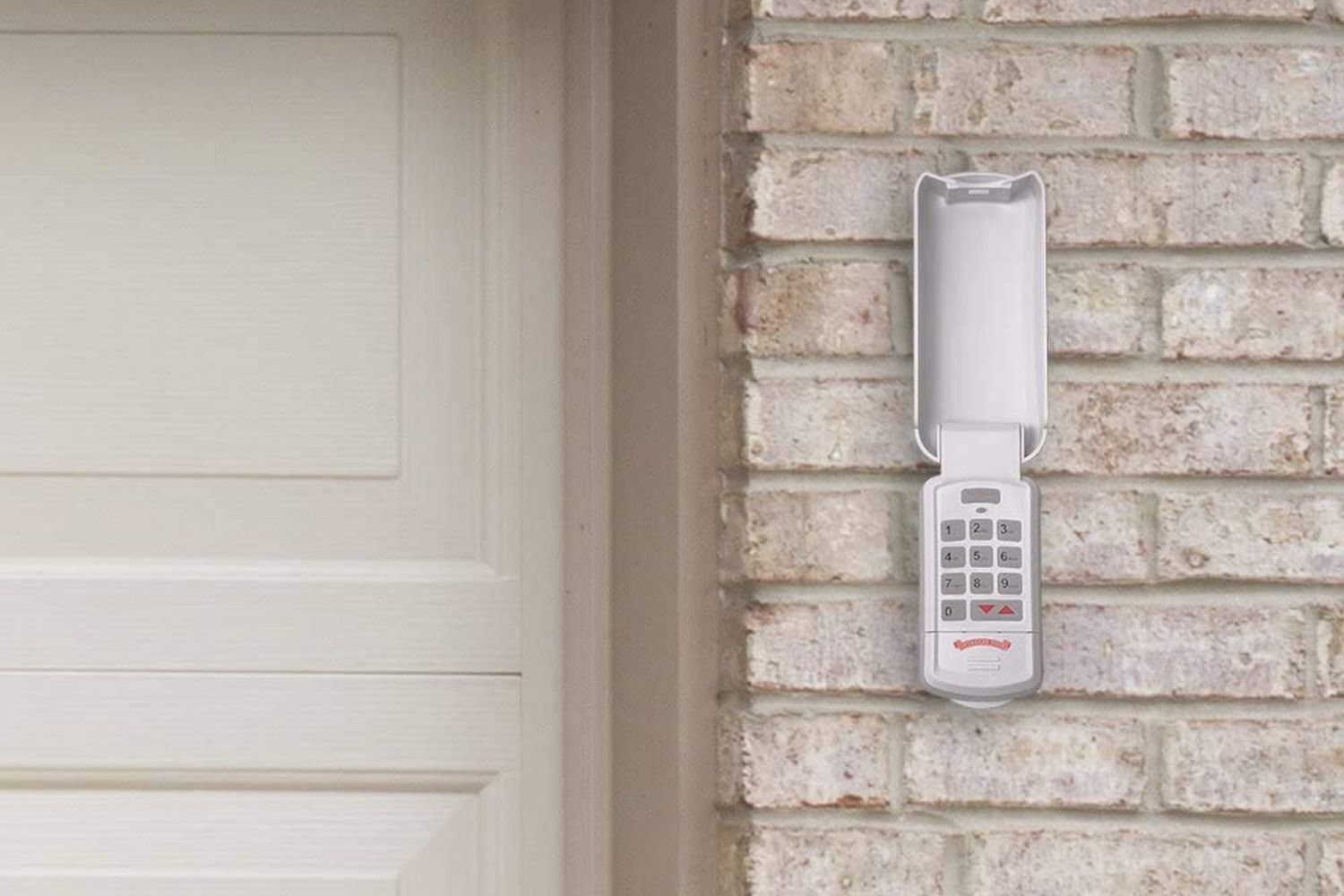 The best garage door keypad option attached to brick siding next to a garage door