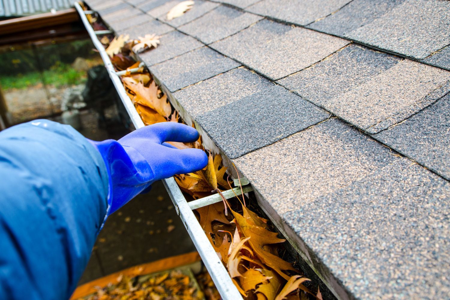 Solved! This Is How Often to Clean Your Gutters - Bob Vila