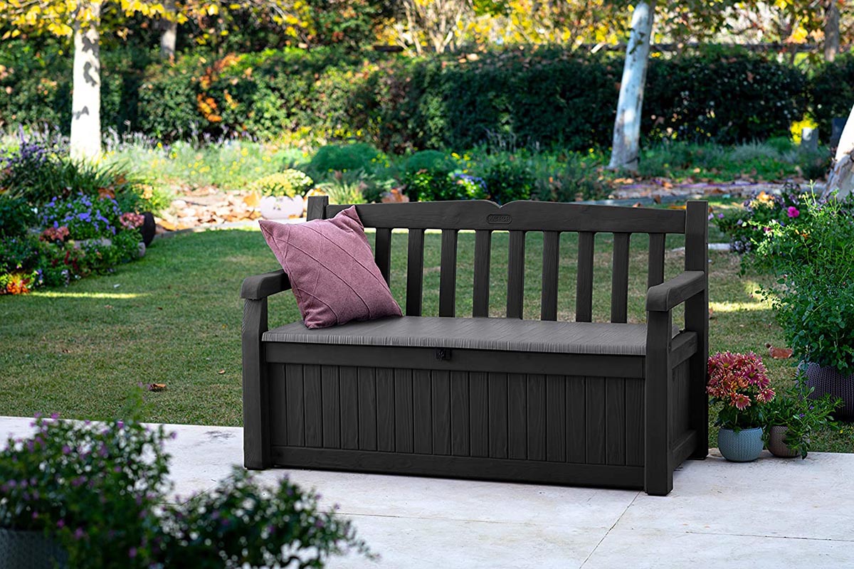 Outdoor bench on a patio in a garden