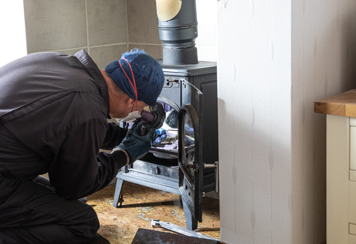 old houses for sale chimney sweep looking at woodburning stove